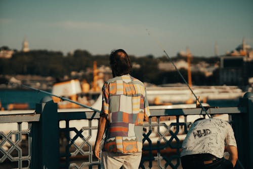 Man Fishing on Pier