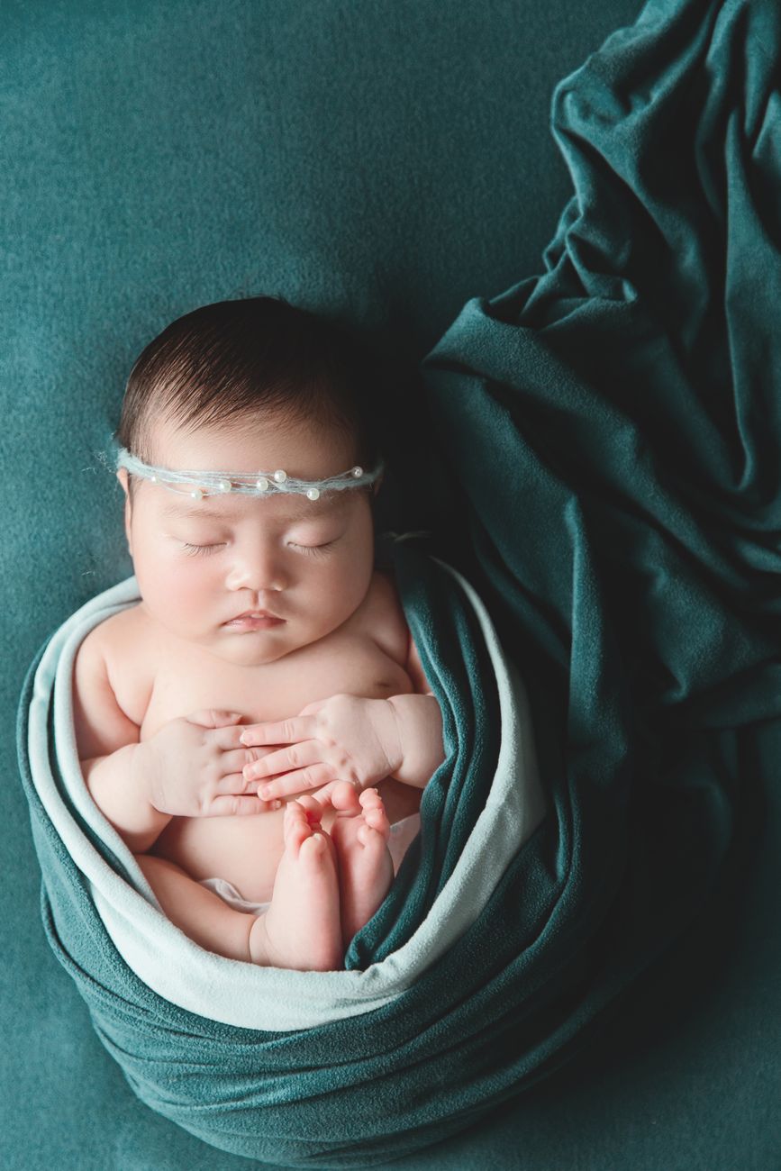 baby swaddled in soft blanket