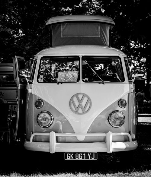 Free A classic Volkswagen camper van captured in a vintage black and white style. Stock Photo