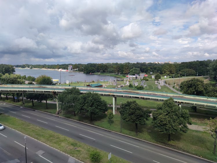 Highway Overpass And Lake At City Outskirts