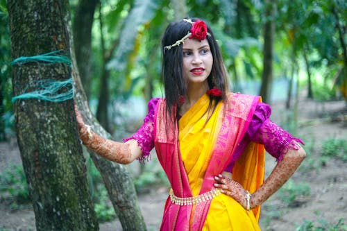 Young Woman Posing Outside Wearing a Colorful Saree 