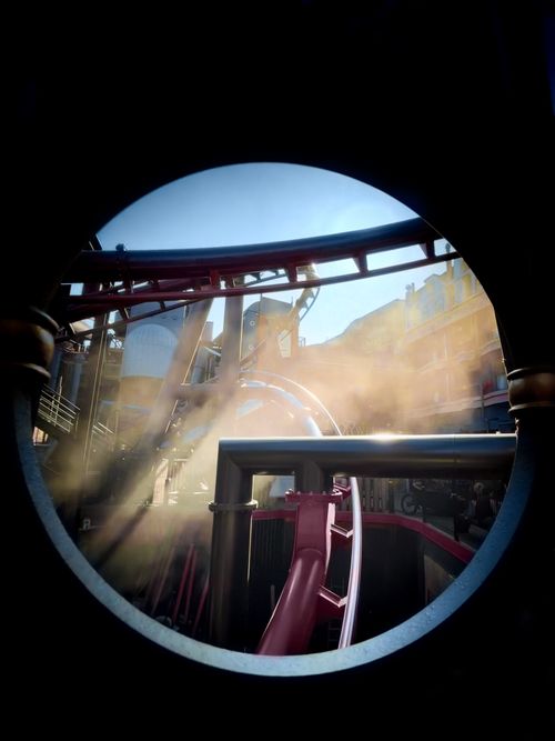 Free Dynamic industrial view featuring pipes, smoke, and urban architecture Stock Photo