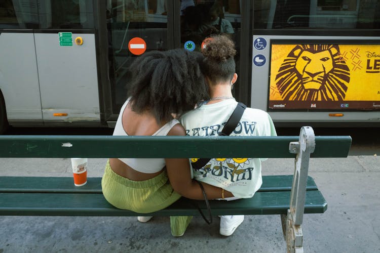 Woman Hugging Man On Bench