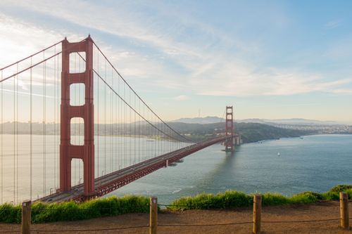 Free Sunlit Golden Gate Bridge spanning San Francisco Bay on a clear day. Stock Photo