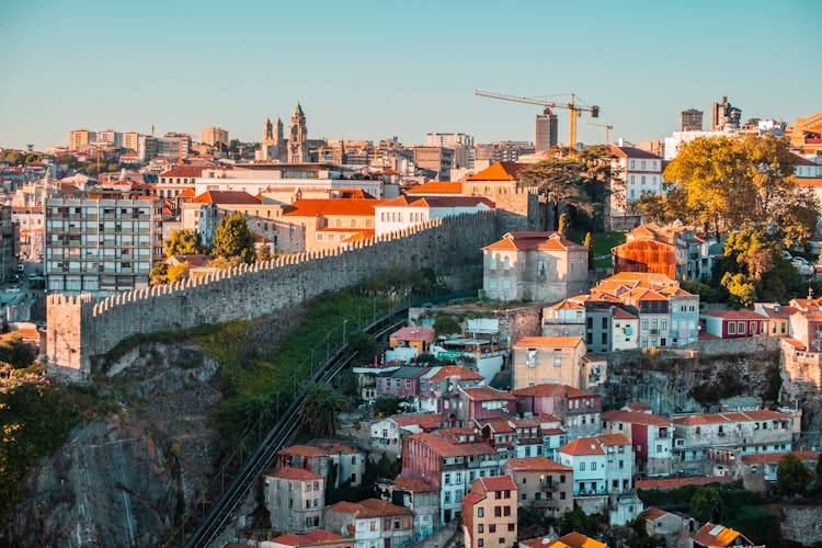 Medieval Wall Among Buildings In City