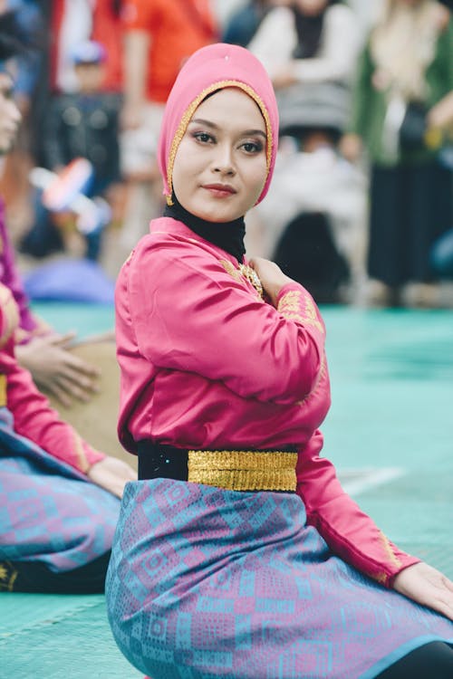 Woman Sitting in Traditional Clothing