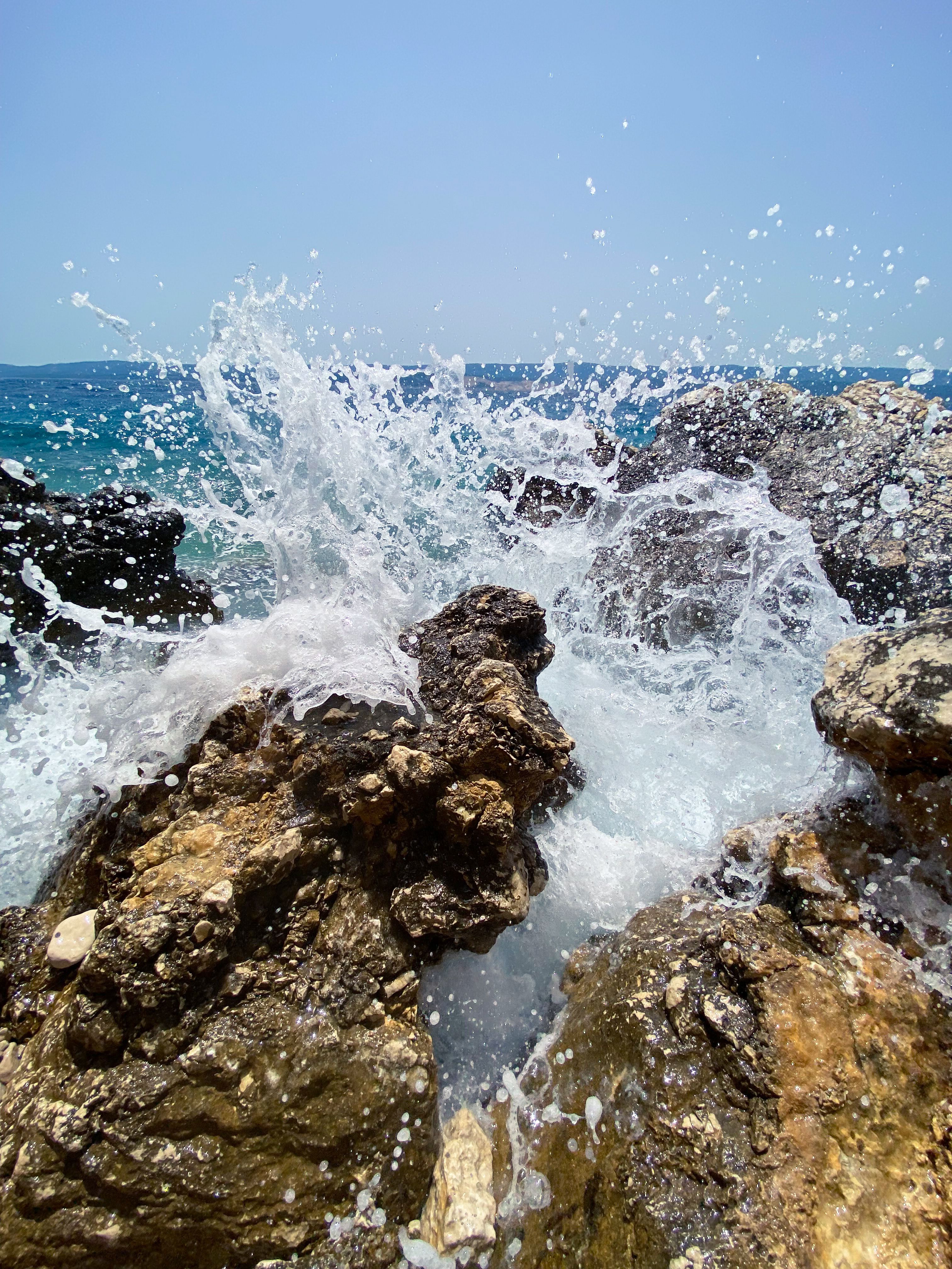 View of Waves Breaking on a Rocky Shore · Free Stock Photo