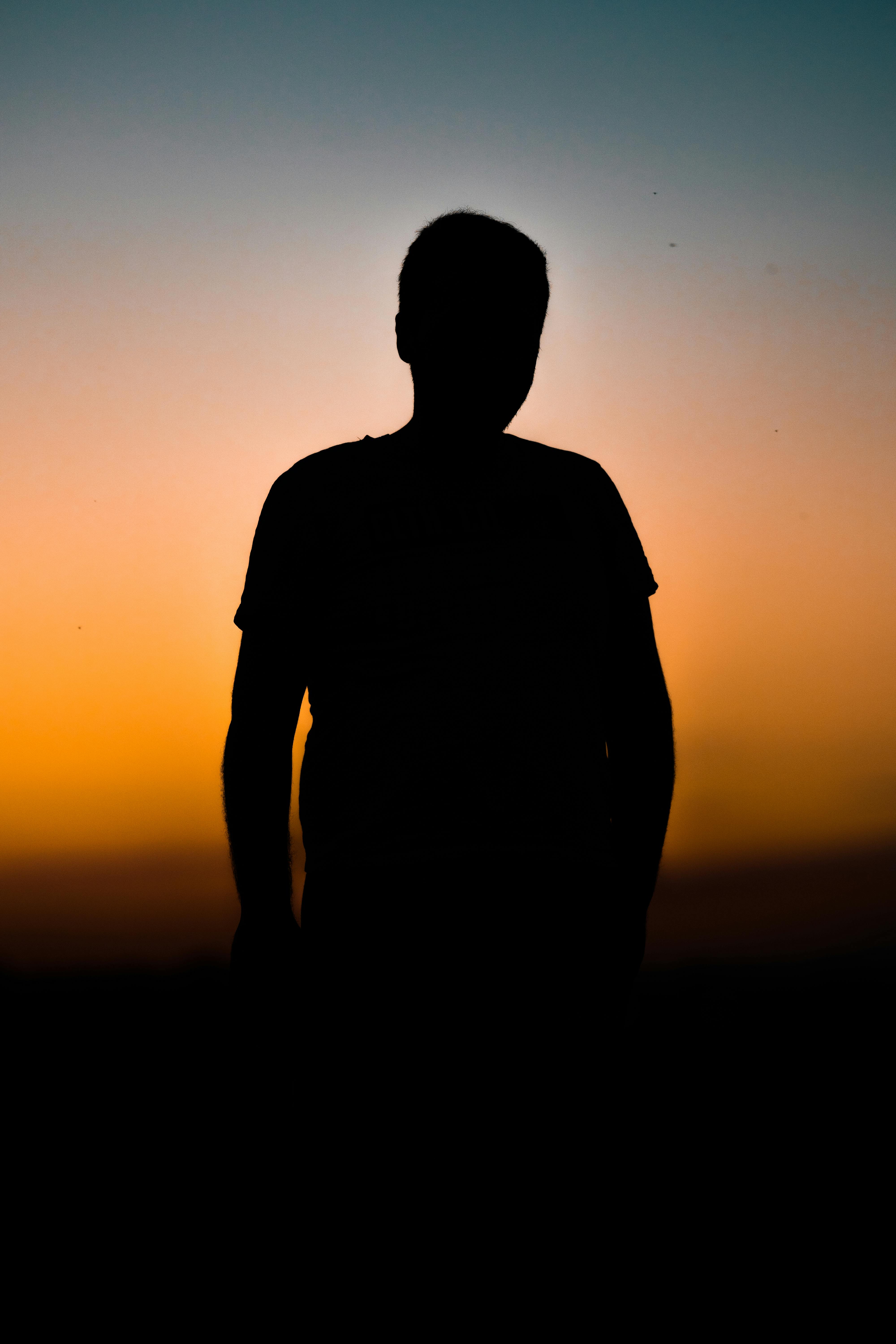 Man on the Background of a Circle from Orange and Blue Light · Free ...