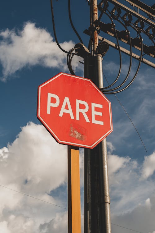 Red Octagon Stop Sign with Text in Spanish