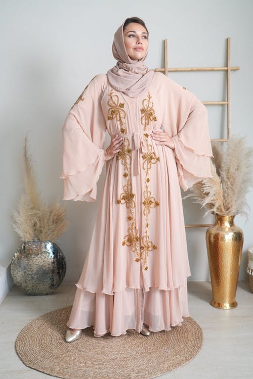 Woman Posing in Pink Embroidered Abaya Dress and Beige Headscarf