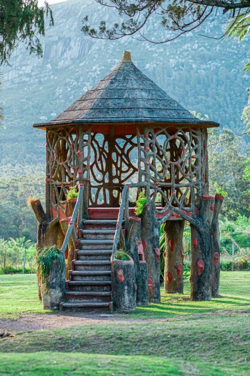 Free Rustic wooden gazebo in a lush park setting, surrounded by scenic mountains in Maldonado, Uruguay. Stock Photo
