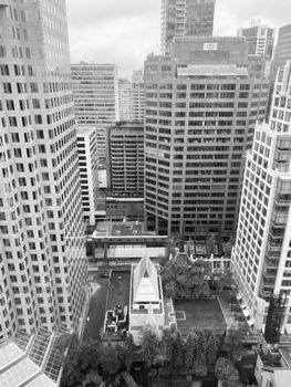 High-angle black and white shot of Vancouver's modern skyscrapers in downtown.