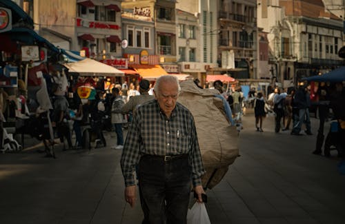 Elderly Man in Shirt Walking in Town in Turkey
