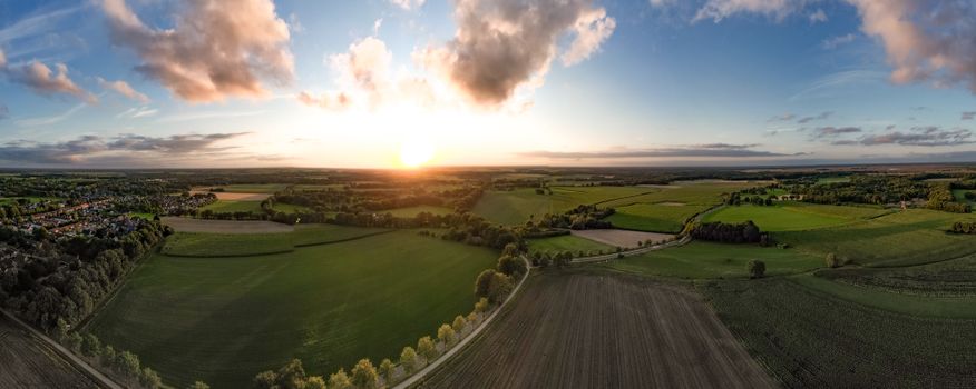 Stunning aerial photograph capturing the tranquil landscapes of Ruinen, Netherlands at sunset.