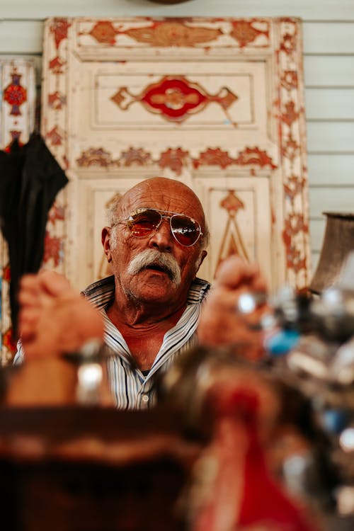 Elderly Man with His Feet on the Table