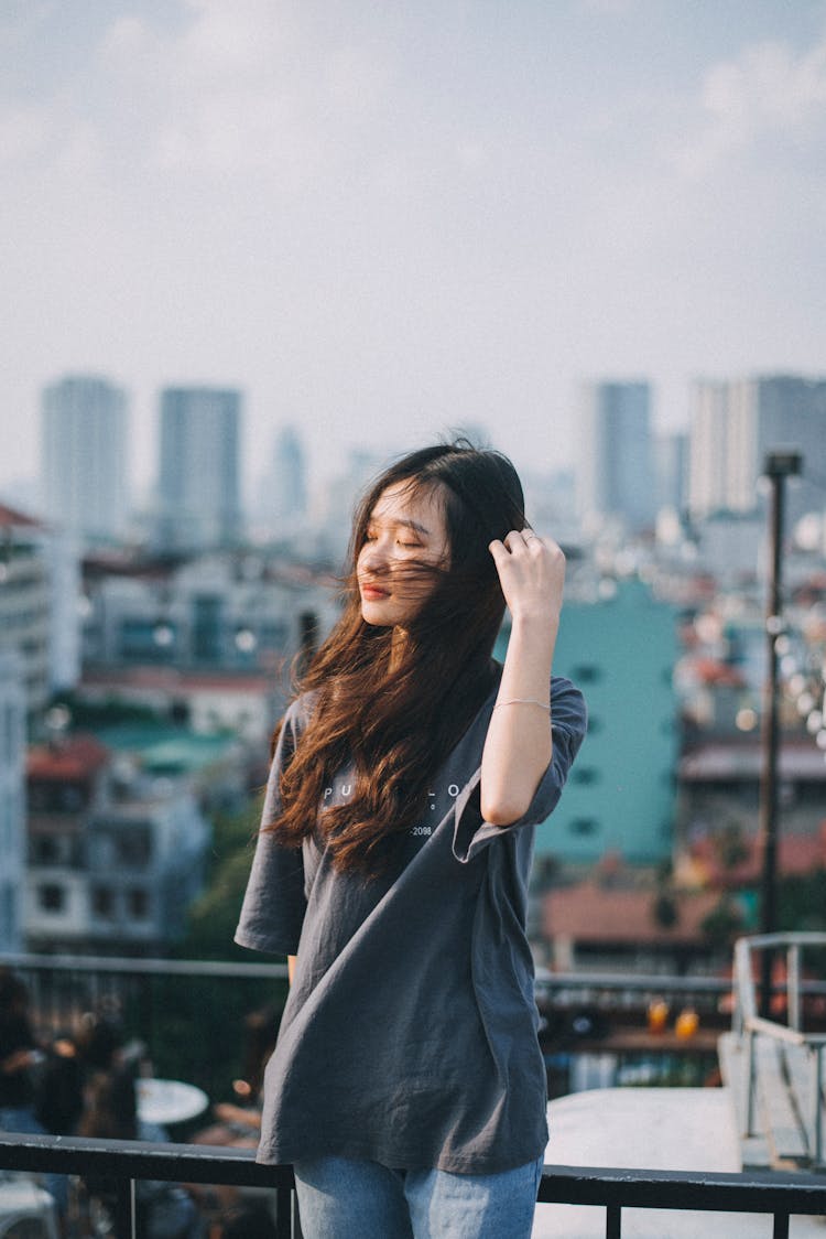 Young Woman In A T-Shirt And Jeans 