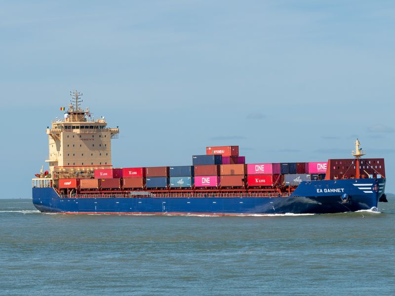 freight manager reviewing carrier contracts at warehouse operations desk