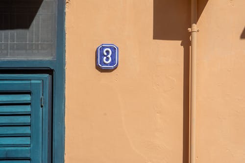 Traditional Building Number Plate on Wall