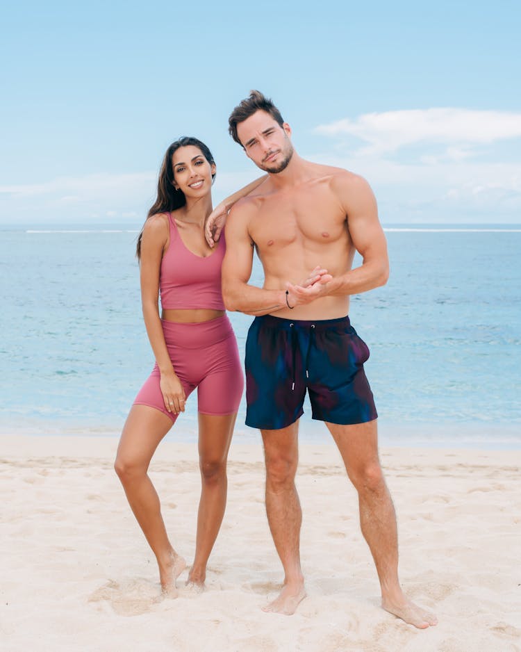 Smiling Couple Standing On Beach