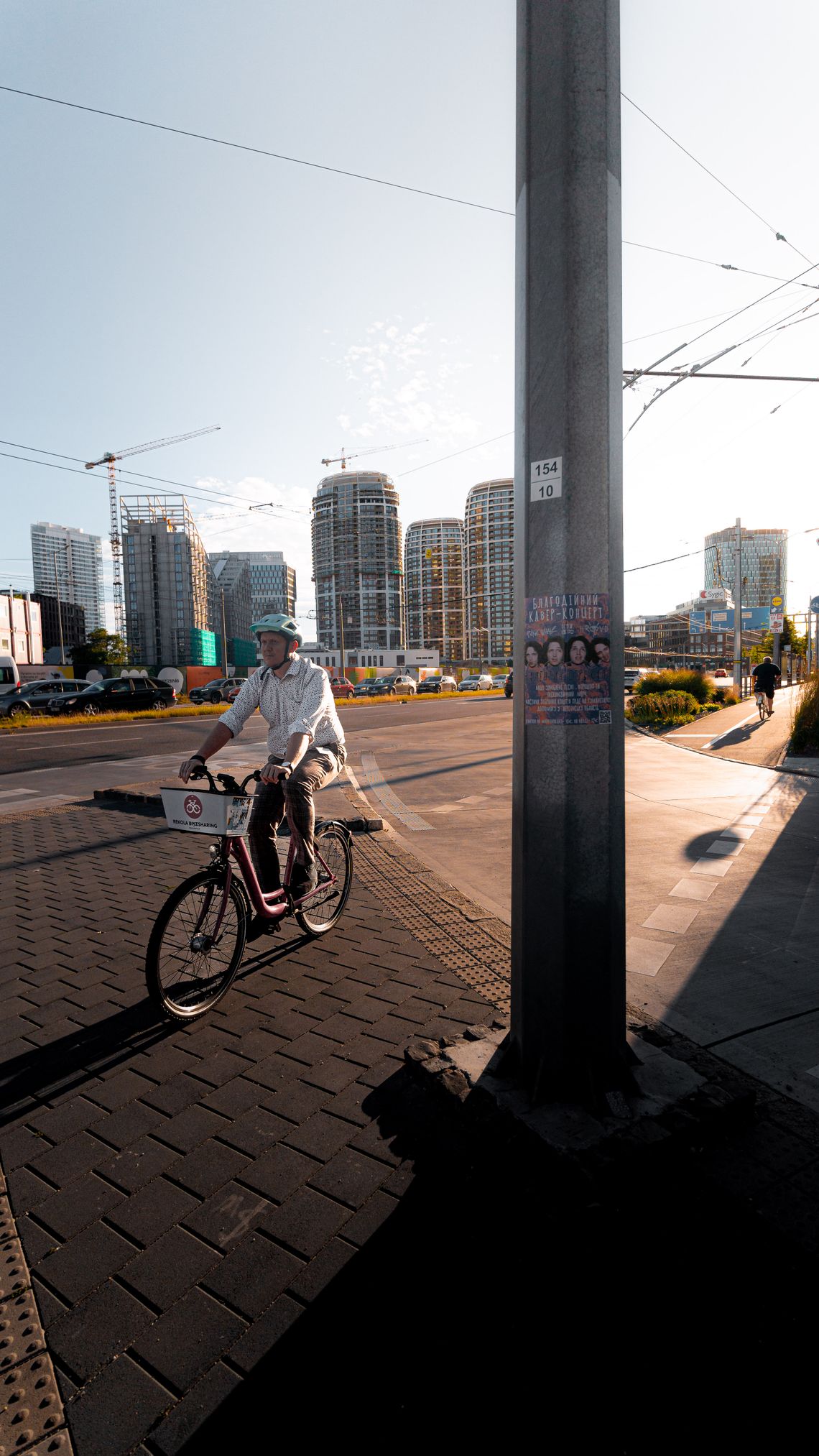 Cyclist riding through a modern urban district