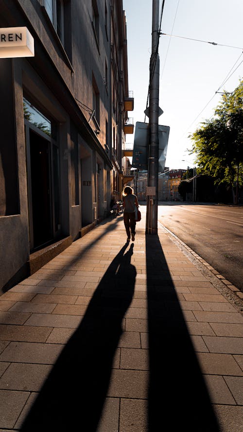 Shadows on Sidewalk Stretched Out by the Setting Sun