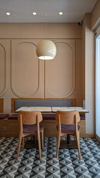 Elegant café interior in Bursa, Turkey with modern design and patterned floor tiles.