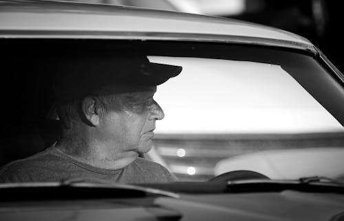 Man Sitting in Car