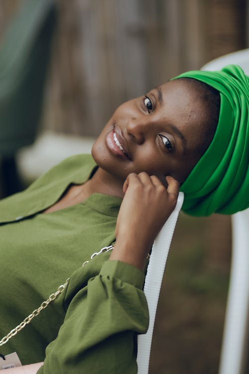 Smiling Woman in Green Clothing