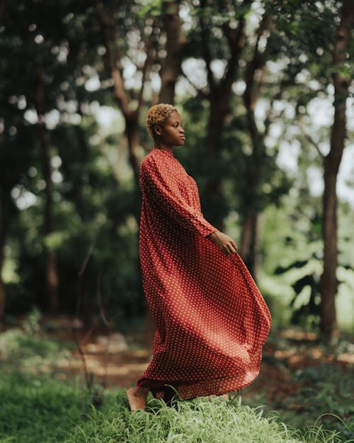 Woman in Red Dress among Trees