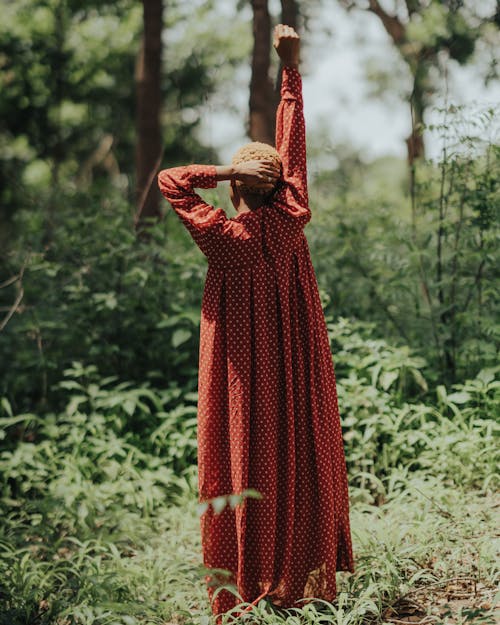 Woman with Short, Dyed Hair Standing in Forest