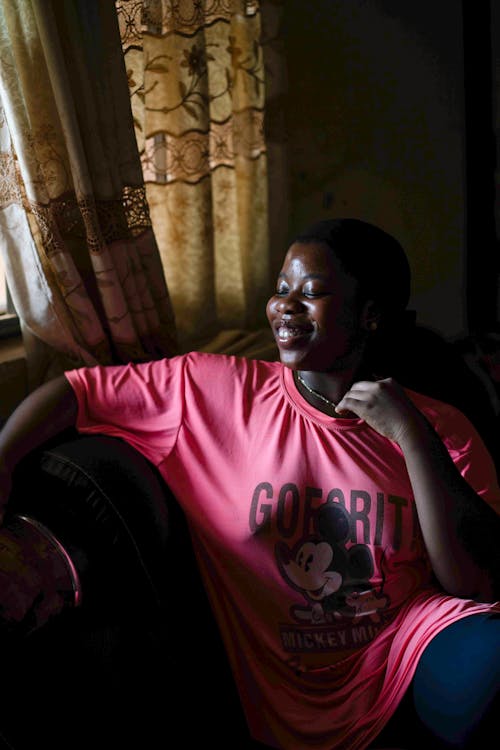 Smiling Woman in Pink Shirt