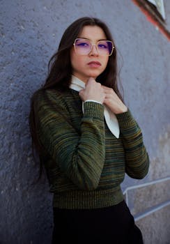 Portrait of a woman with glasses by a wall in Los Pinos, Mexico City.