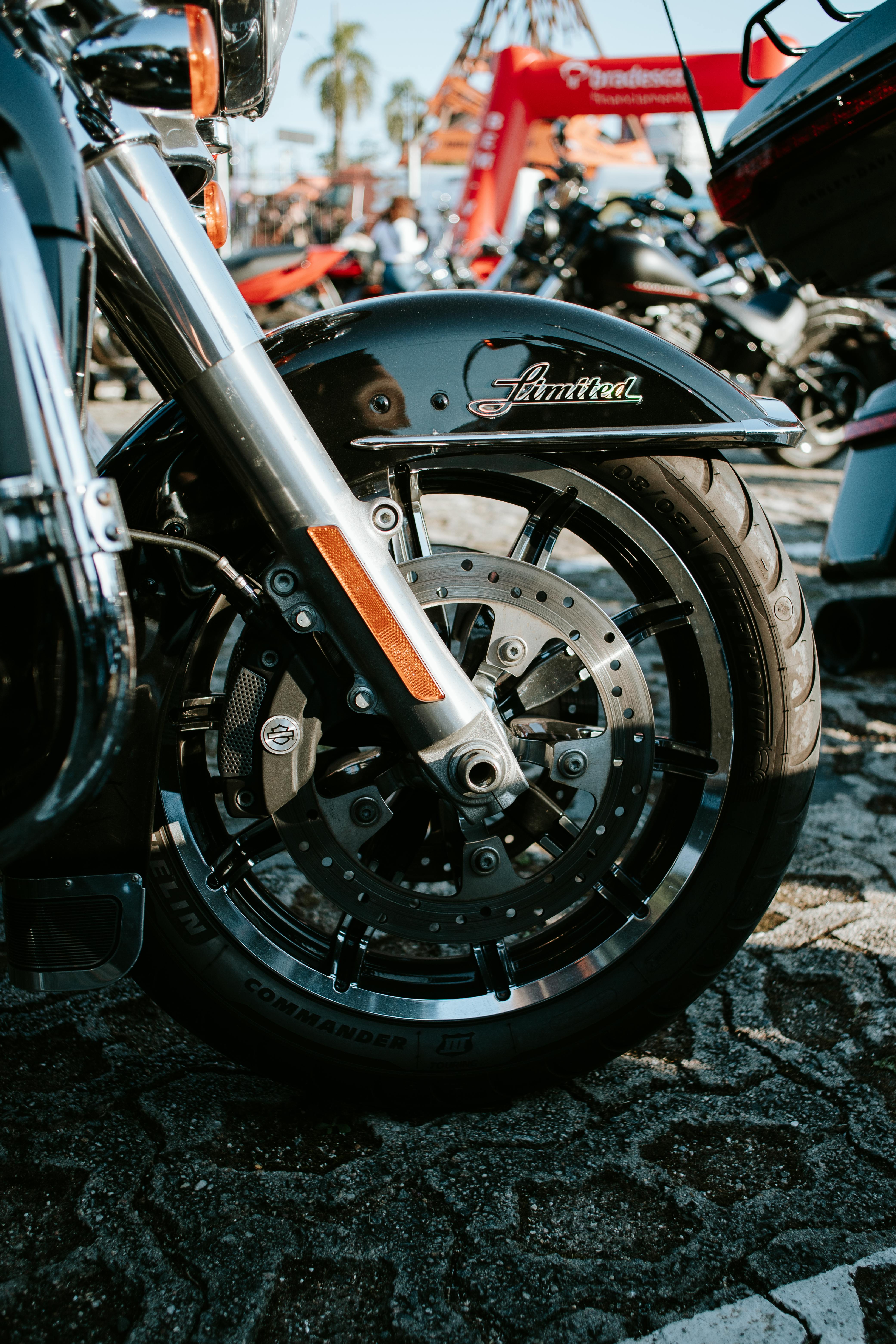 Close-up shot of a motorcycle wheel with limited edition branding in an outdoor setting.