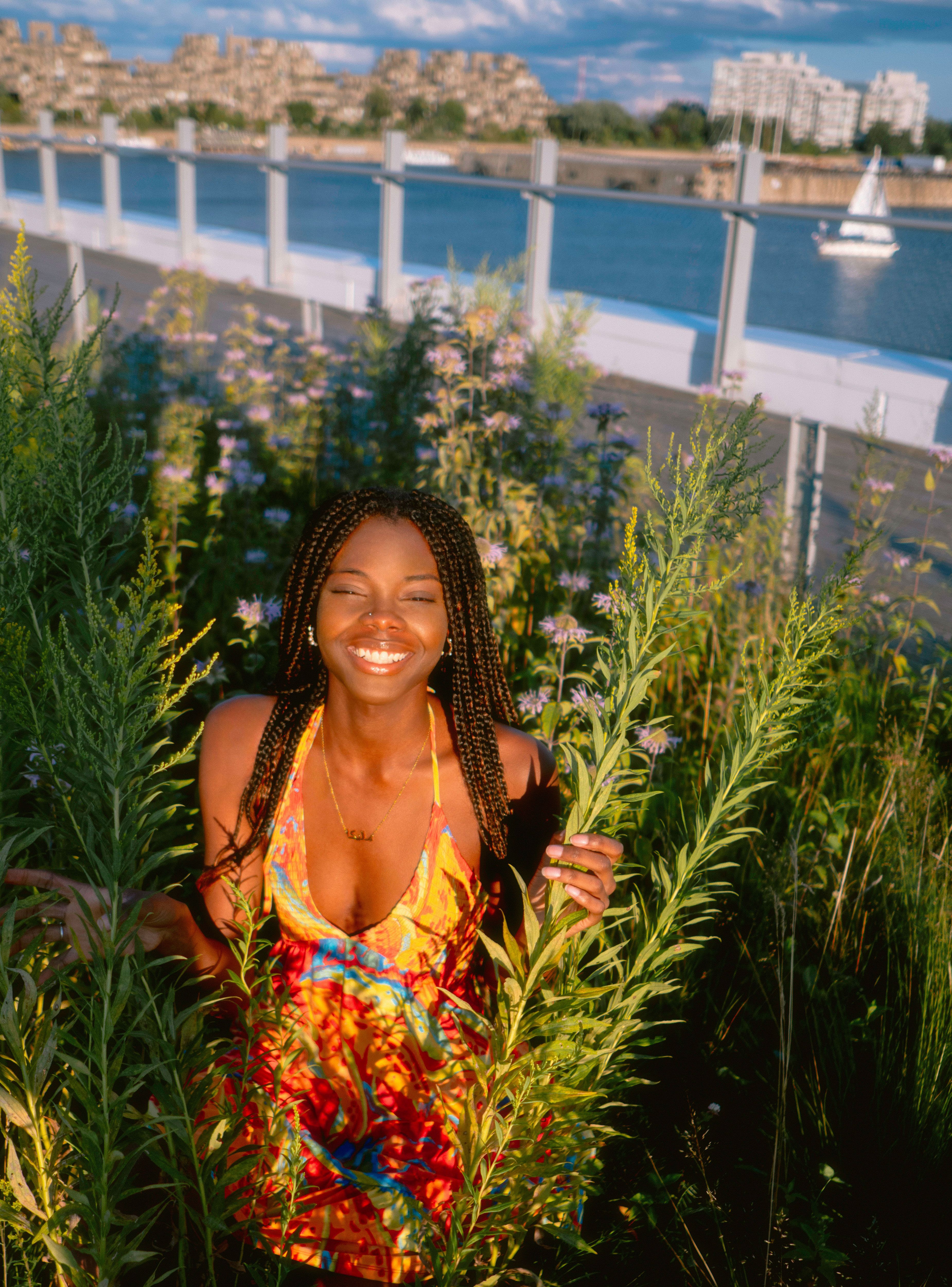Bright and cheerful portrait of a woman enjoying a summer day in a Montréal park.