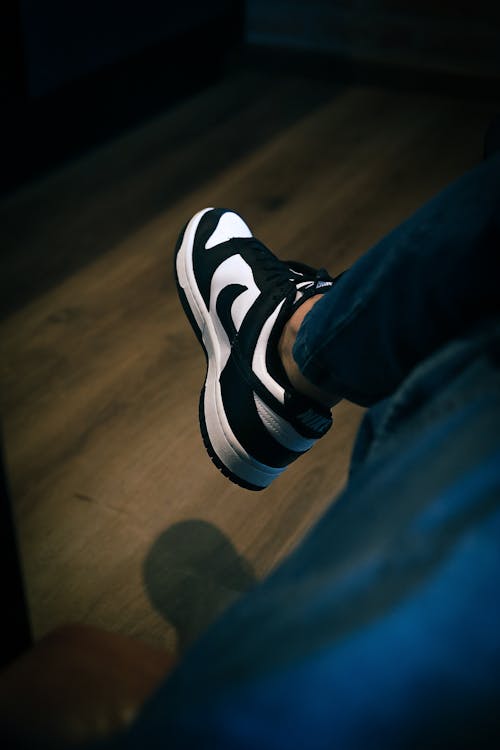 Black and White Trainer on Foot