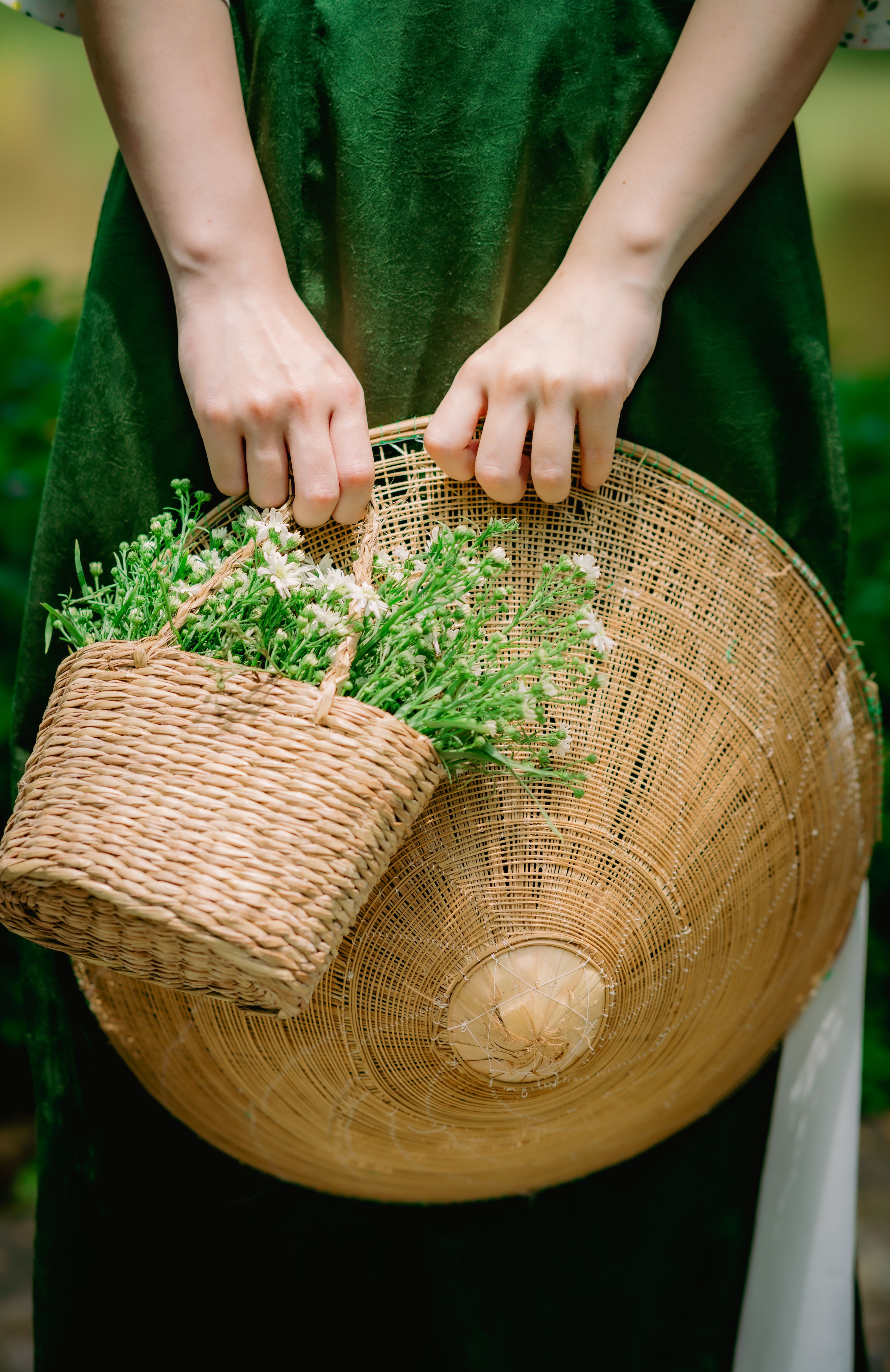 Woman Hand Holding Wicker Basket and Hat · Free Stock Photo