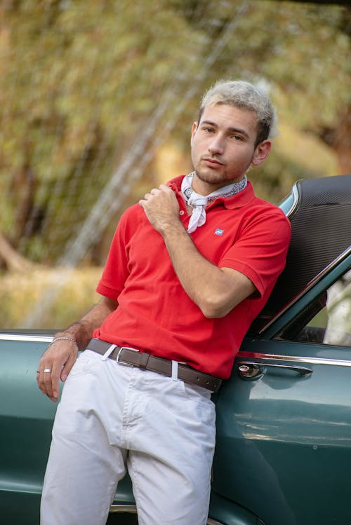 Blonde Man Standing by Car