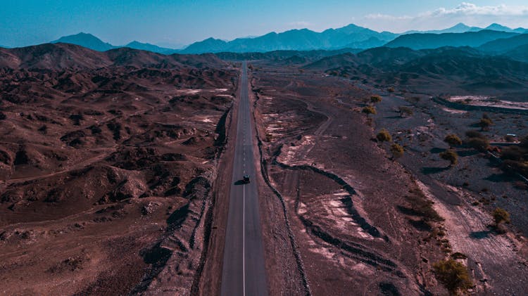 Car On Road On Arid Wasteland