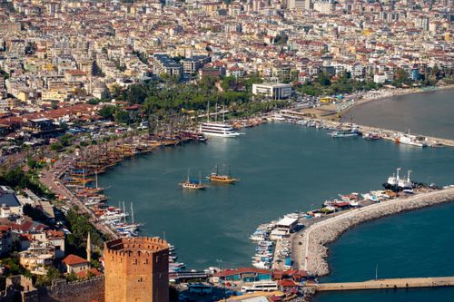 Free Explore the picturesque Alanya harbor with its iconic Red Tower and vibrant marina from above. Stock Photo
