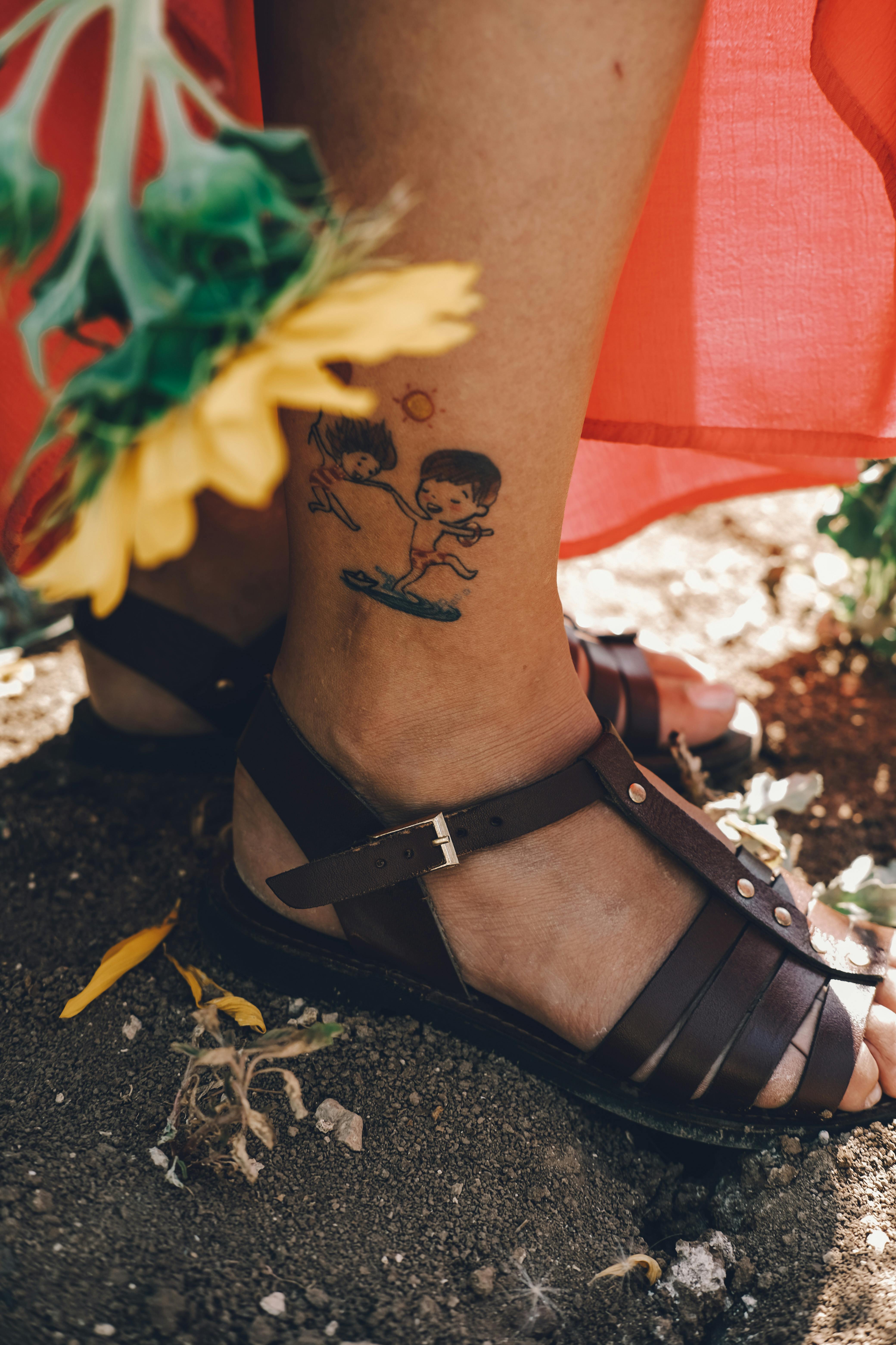Closeup ankle tattoo woman | Premium PSD Mockup - rawpixel