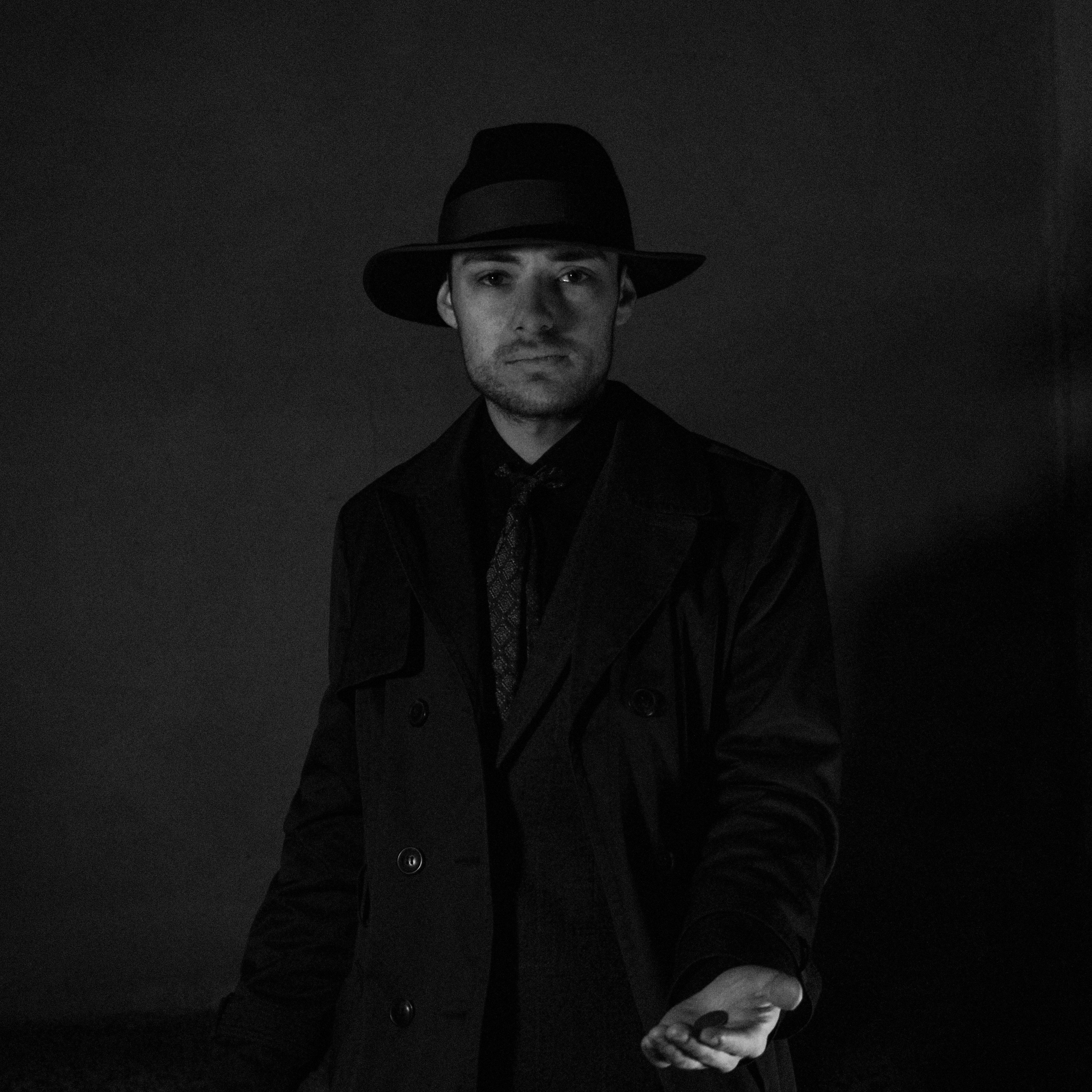 Portrait of a Man in Fedora Hat, Suit and Trench Coat · Free Stock Photo