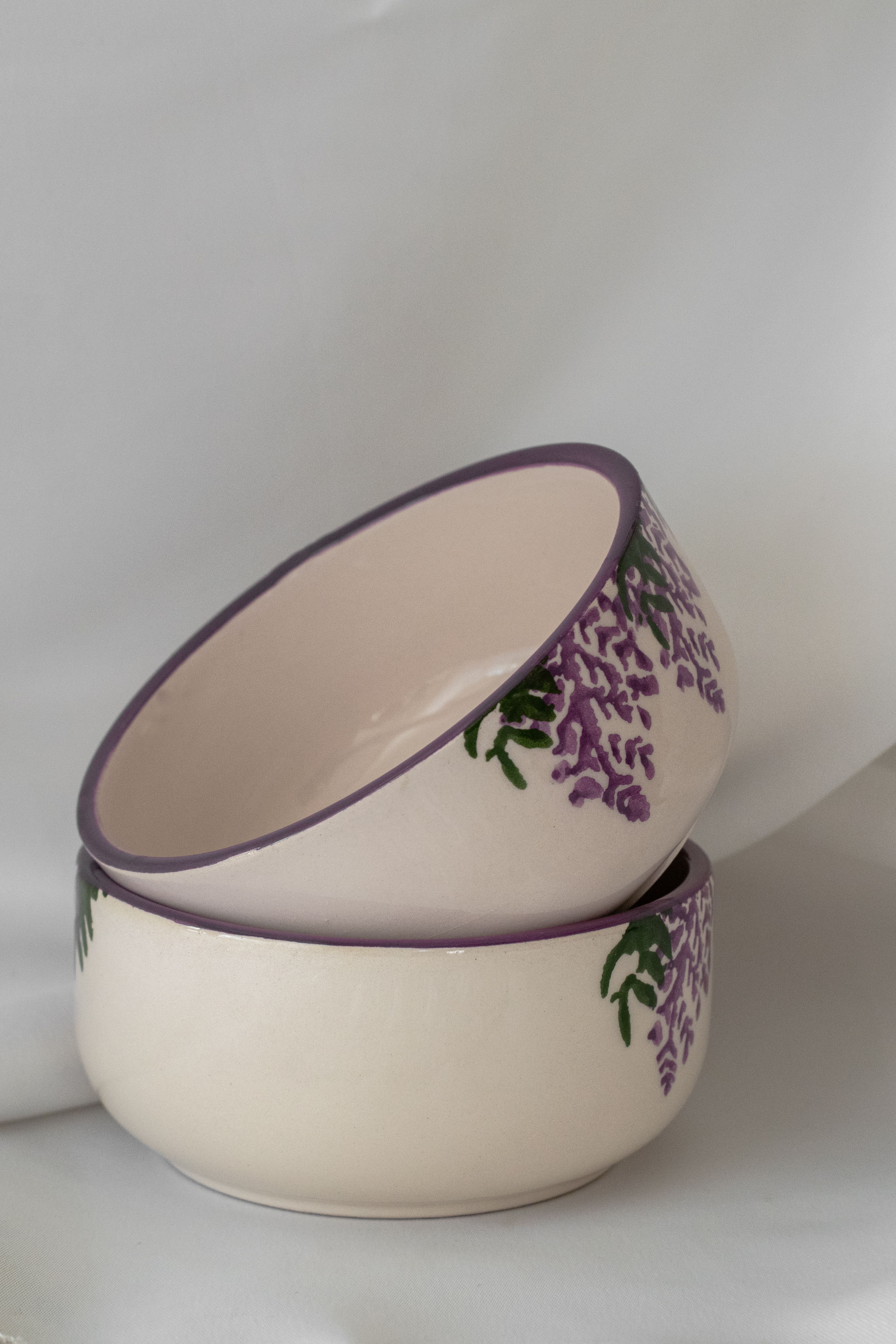 Ceramic bowls with floral patterning — photo by Berna on Pexels