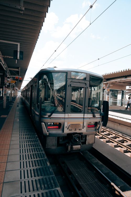 Free A modern train at Fukuchiyama Station in Kyoto, Japan, showcasing urban transport. Stock Photo