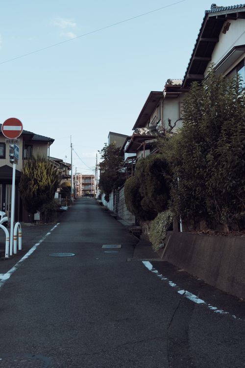 Free Tranquil view of a residential street in Fukuchiyama, Kyoto, showcasing traditional Japanese houses. Stock Photo