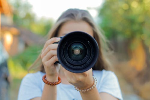 Woman Taking Picture Camera with Professional Lens