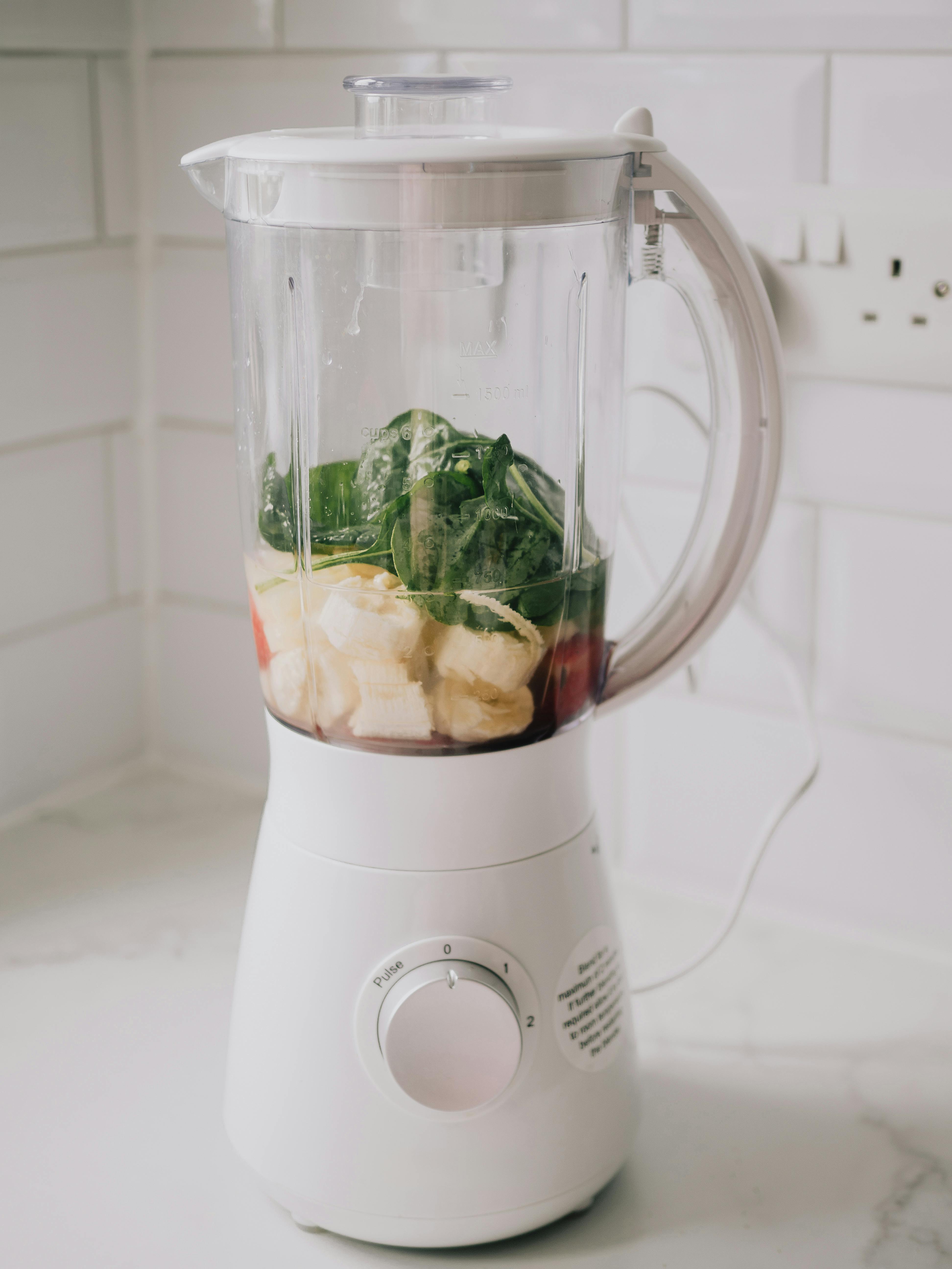 Free A blender filled with bananas, spinach, ready for a healthy smoothie. Stock Photo