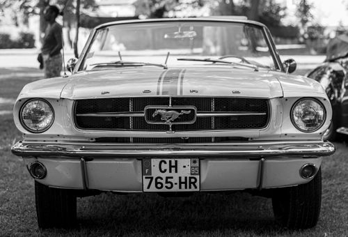 Free Vintage Ford Mustang in black and white, highlighting its retro style and classic design. Stock Photo