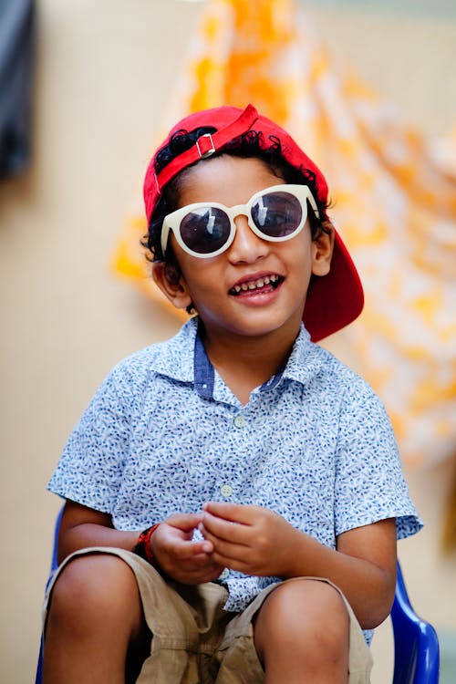 Smiling Boy in Shirt and Sunglasses
