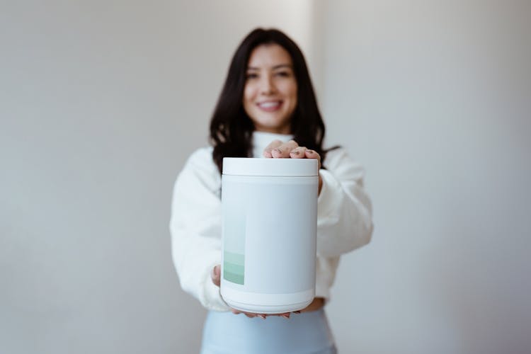 Smiling Woman Holding White Box