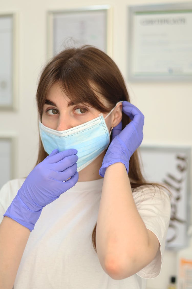 Woman In Mask And Gloves